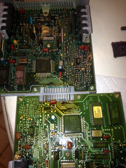 1961 International Scout 800 - Close-up view of two complex electronic circuit boards, likely from a vehicle's control system.