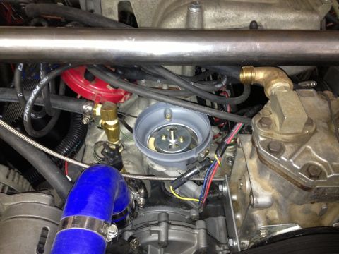 1961 International Scout 800 - Engine bay details show various components like the distributor, hoses, and metal piping.