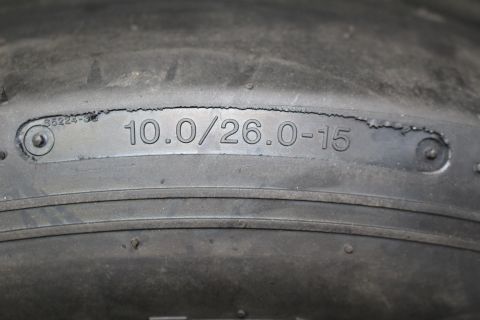 2003 Ford Crown Victoria - Close-up of a drag slick sidewall with the molded size designation 10.0/26.0-15.