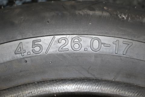 2003 Ford Crown Victoria - Close-up of a tire sidewall stamped with the size 4.5/26.0-17.