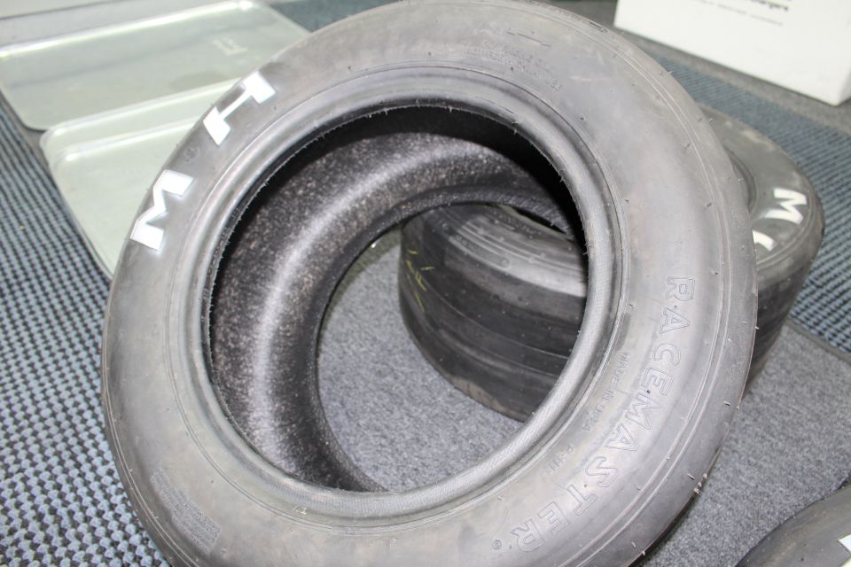 M H Racemaster drag slick tire viewed through its open center on carpet
