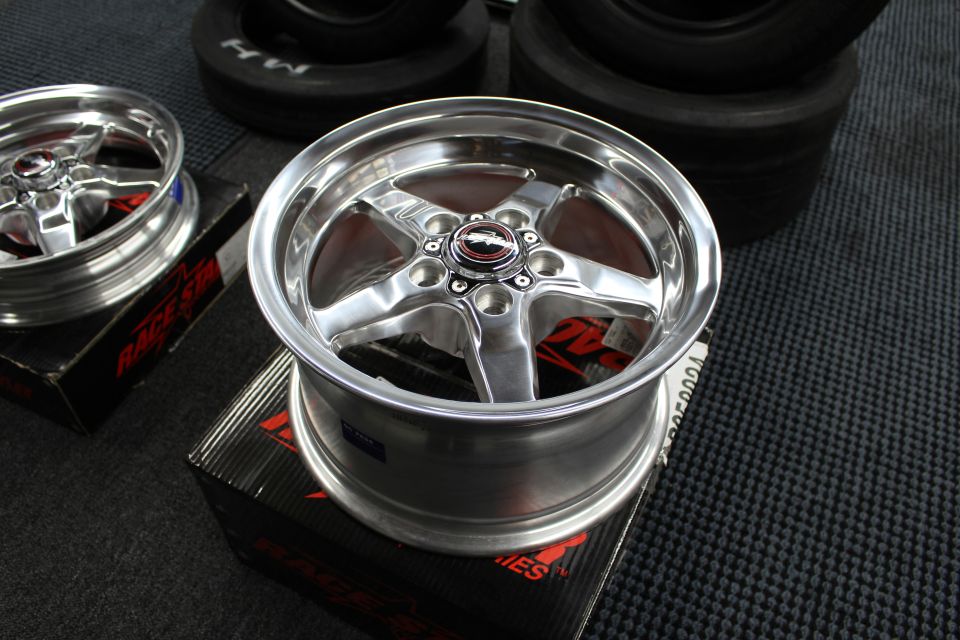 Polished deep-lip Race Star five-spoke wheel on its box