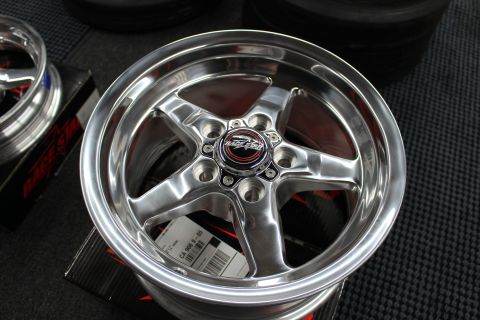 2003 Ford Crown Victoria - polished Race Star five-spoke wheel rests on its box, with a second polished wheel and box behind.