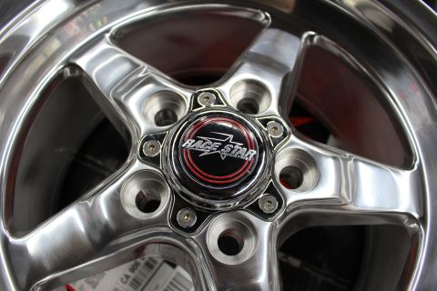 2003 Ford Crown Victoria - Close-up of a polished Race Star five-spoke wheel showing the center cap and five-lug bolt pattern.