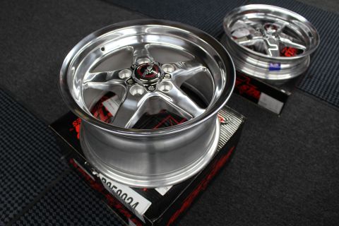 2003 Ford Crown Victoria - Two polished wide-lip Race Star five-spoke drag wheels sit on their boxes on a garage mat.
