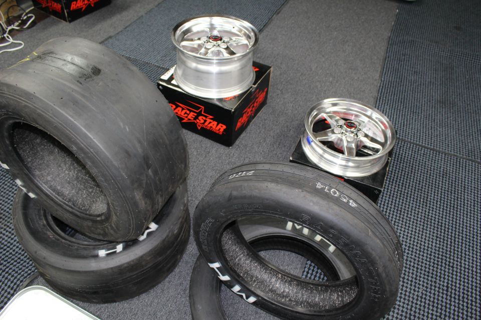 M/H drag slick tires and two polished Race Star wheels on boxes