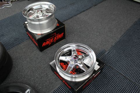 2003 Ford Crown Victoria - Two polished Race Star five-spoke wheels rest on boxes, one face-up and one standing on edge.