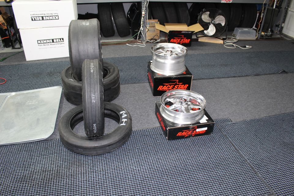 Drag slicks and polished Race Star wheels with Kenne Bell boxes behind