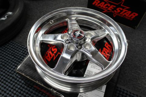 2003 Ford Crown Victoria - polished five-spoke aluminum drag-racing wheel with a red logo center cap rests on a Race Star Industries box.