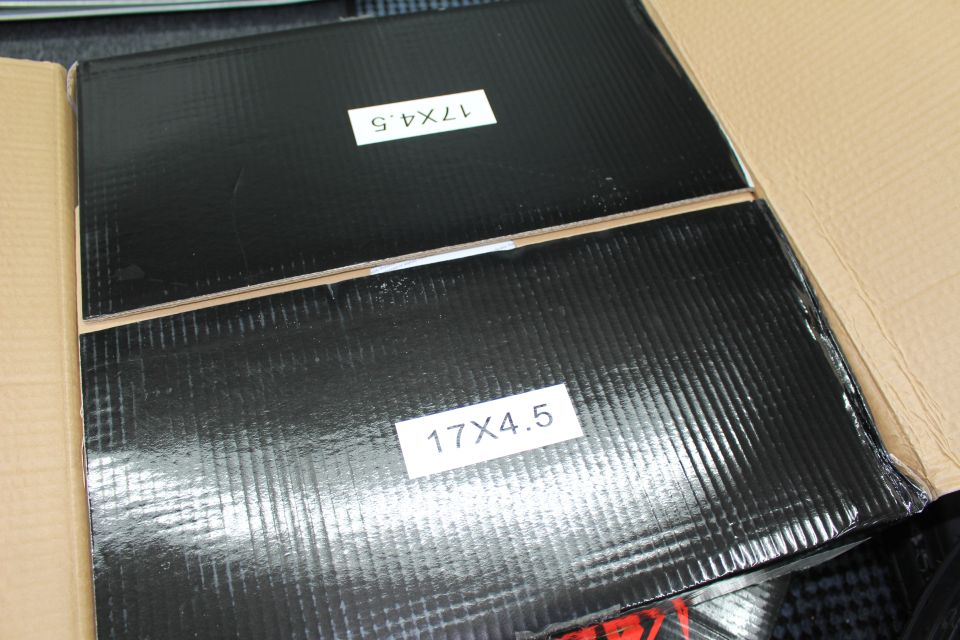 Two black wheel boxes labeled 17X4.5 stacked together
