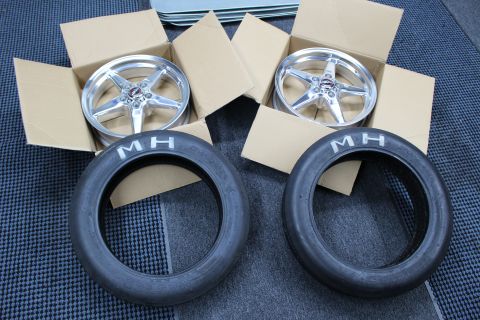 2003 Ford Crown Victoria - matched pair of polished five-spoke drag wheels in cardboard boxes sit behind two M/H drag tires.