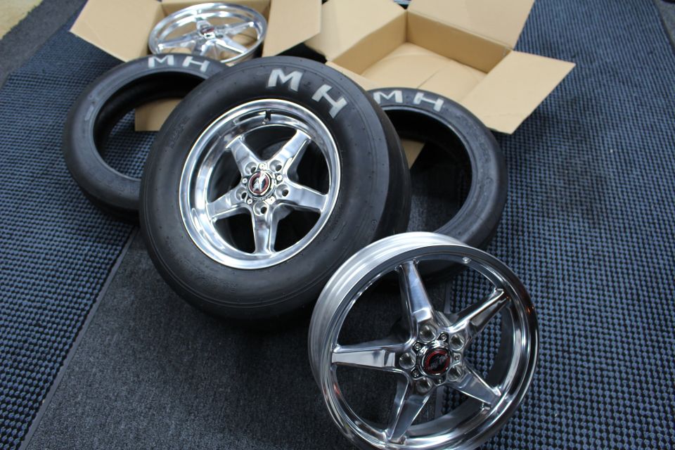 Polished drag wheel on MH slick with a bare wheel and skinny tire alongside