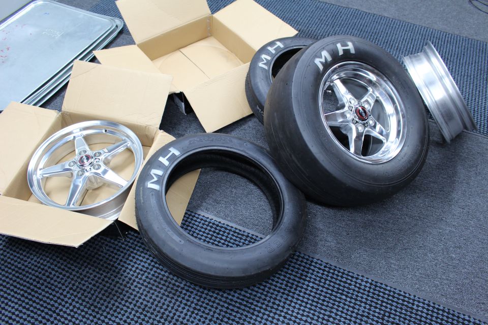 Polished drag wheel on MH slick with a bare wheel, boxes and loose tires