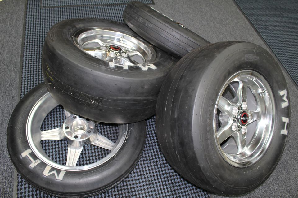 Stacked M&H drag slicks on polished and brushed five-spoke aluminum wheels