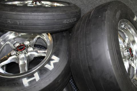 2003 Ford Crown Victoria - Polished five-spoke wheels mounted on drag slicks with white MH sidewall lettering rest grouped together.
