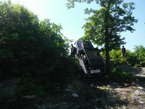 1988 Ford Bronco - This 1988 Ford Bronco navigates a challenging off-road course, demonstrating its capabilities.