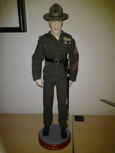 2003 Ford Crown Victoria - A mannequin dressed as a USMC drill instructor stands on a display base with 'U.S.M.C.' visible.