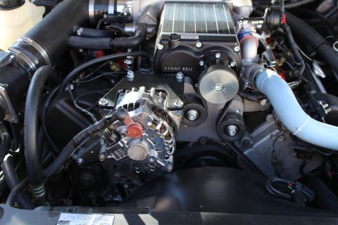 2003 Ford Crown Victoria - Kenne Bell supercharger sits above a chrome alternator and belt drive in a detailed engine bay.