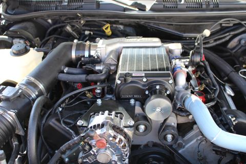 2003 Ford Crown Victoria - Kenne Bell supercharger tops an engine with a blue coolant hose, chrome alternator and belt drive.