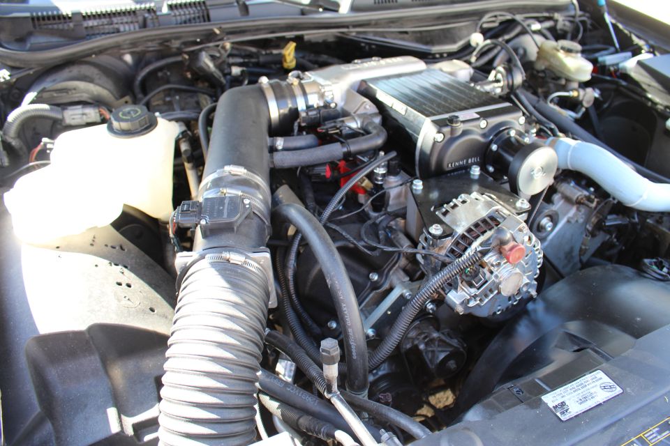 Engine bay with Kenne Bell supercharger and corrugated intake hose