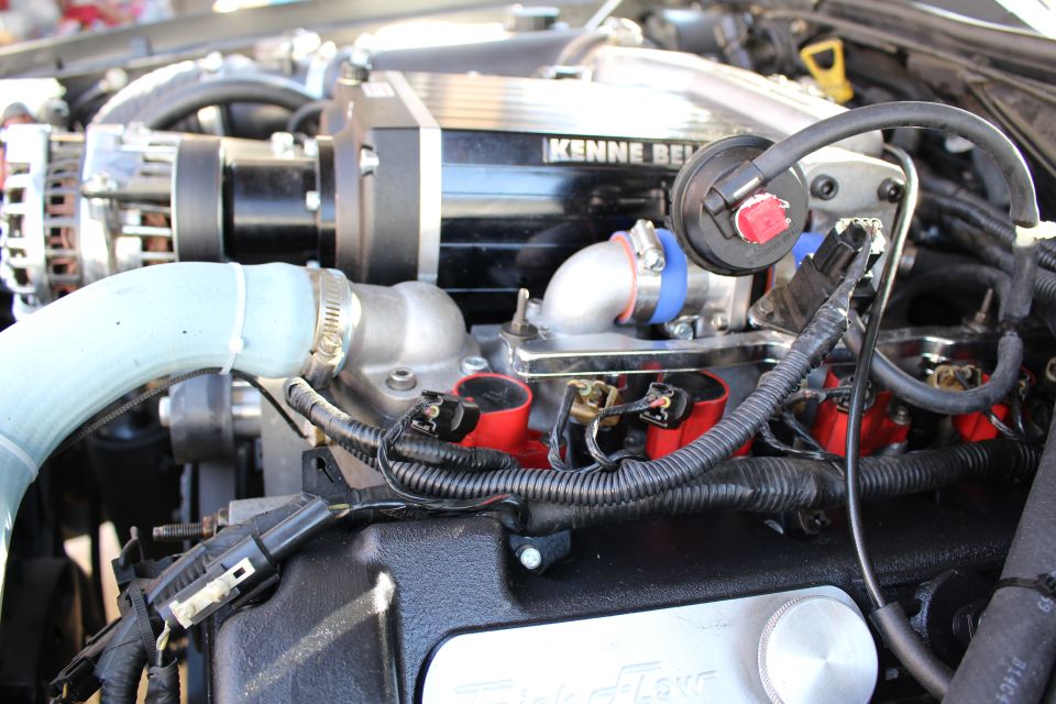 Kenne Bell supercharger with intake elbow and red coils