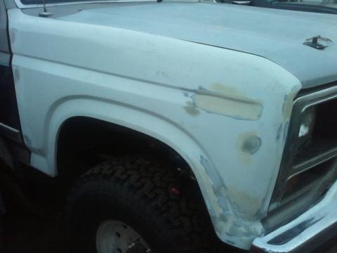 1986 Ford Bronco - This Ford truck is undergoing body repairs, with primer and filler visible on the fender and fender.