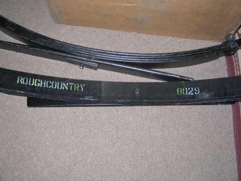 1995 Ford Bronco - Leaf springs with 'ROUGHCOUNTRY' and '8029' stenciled in yellow are shown.