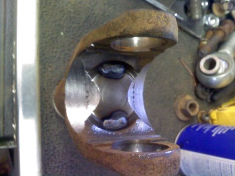 1986 Ford Bronco - A universal joint, likely from a drivetrain, shows signs of wear and repair with visible welding.
