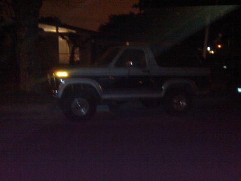 1986 Ford Bronco - This 1986 Ford Bronco is seen in a three-quarter front view at night.