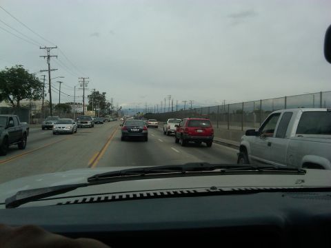 1986 Ford Bronco - Driving on a highway with multiple vehicles in traffic.