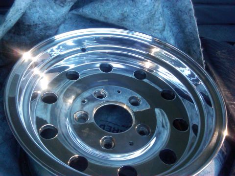 1986 Ford Bronco - Close-up of a polished chrome wheel, likely for a truck or SUV.