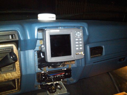 1986 Ford Bronco - Interior view of a vehicle's dashboard, showing aftermarket electronics and a visible 'LOWRANCE' unit.