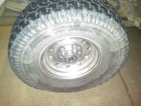 1986 Ford Bronco - Close-up of a vehicle's tire and wheel assembly.