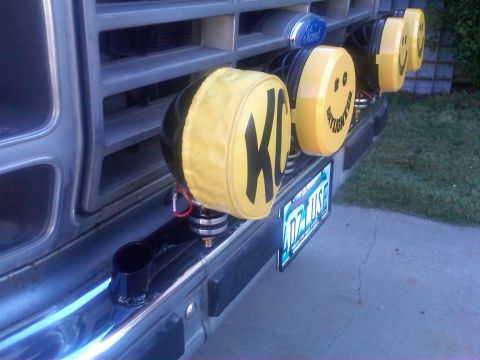1986 Ford Bronco - KC lights with smiley face covers adorn the front grille of a 1986 Ford Bronco.