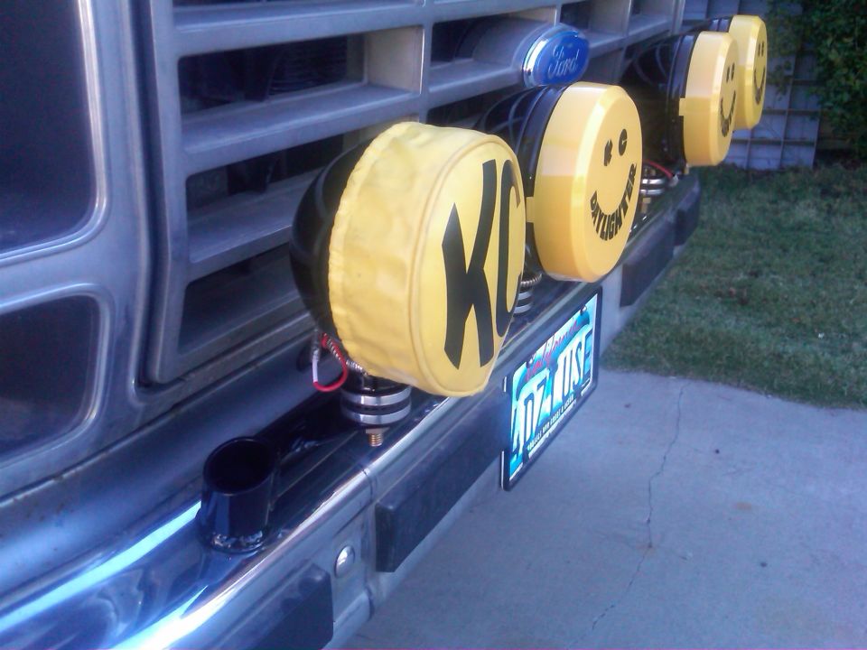 1986 Ford Bronco front grille with KC lights and smiley face covers