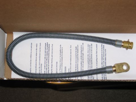1995 Ford Bronco - A flexible metal hose with brass fittings is shown inside a cardboard box with installation instructions.