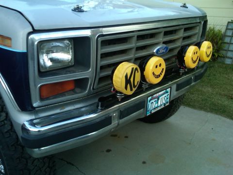 1986 Ford Bronco - This 1986 Ford Bronco features custom KC lights with smiley face covers on the front grille.