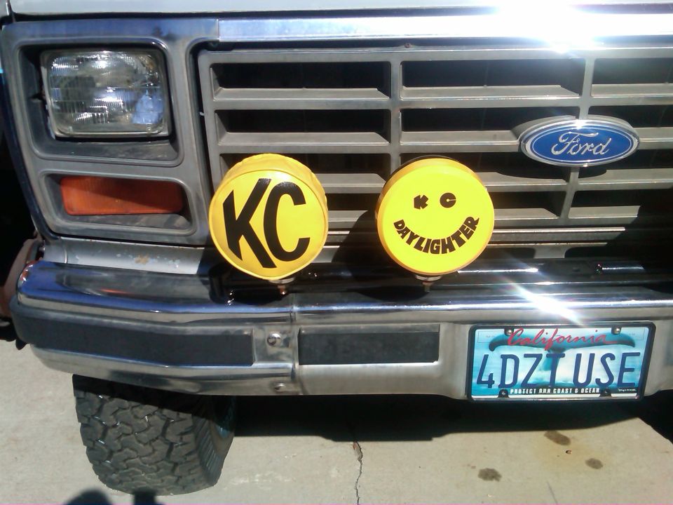 Front of a Ford truck with KC Daylighter lights and a California license plate
