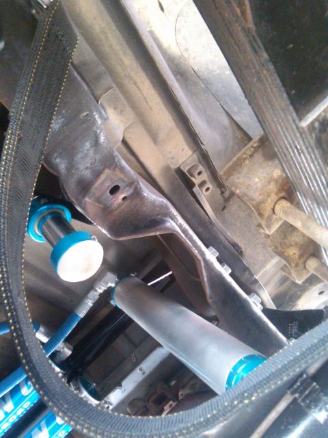 1986 Ford Bronco - Close-up view of the undercarriage, showing suspension components and a SuperMotors.net watermark.