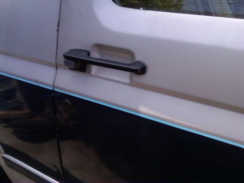 1986 Ford Bronco - The side door handle and two-tone trim are visible on this 1986 Ford Bronco.