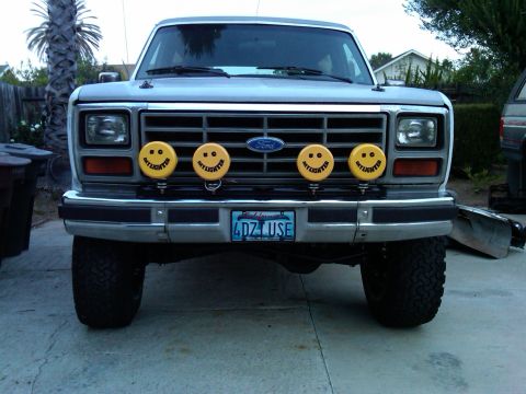 1986 Ford Bronco - This Ford Bronco from the early 1980s features custom smiley face auxiliary lights above the front bumper.