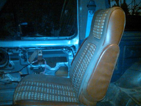 1986 Ford Bronco - Interior view of a 1986 Ford Bronco, with the driver's side door panel removed.
