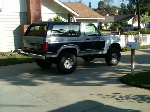1986 Ford Bronco - Two-tone 1986 Ford Bronco with aftermarket wheels and tires.