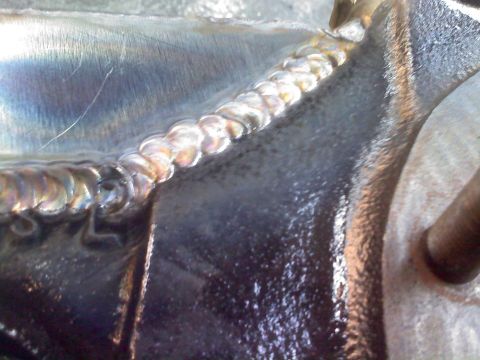 1986 Ford Bronco - Detail of a metal component showing the texture and pattern of the welding.