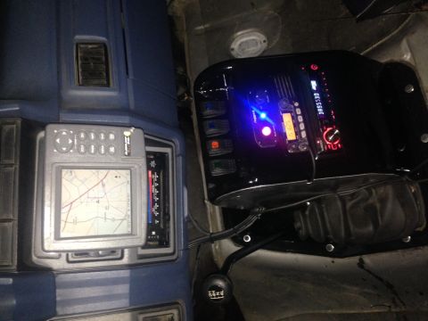 1986 Ford Bronco - Aftermarket GPS and stereo system installed in the dashboard of a vehicle.