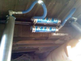 1986 Ford Bronco - King Off-Road shocks are visible on the underside of a vehicle.