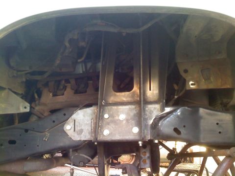 1986 Ford Bronco - Custom metalwork is visible on the undercarriage of this vehicle, likely for suspension or frame reinforcement.