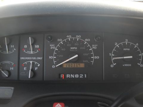 1994 Ford Bronco - The odometer shows 280,337.7 miles on the dashboard gauges.