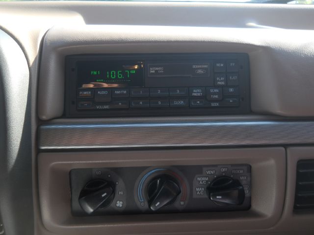 1994 Ford Bronco interior showing radio display and climate controls