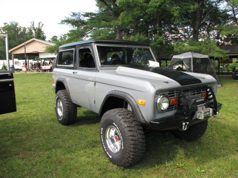 1979 Ford Bronco - This classic Ford Bronco is displayed outdoors with a picnic shelter and tents in the background.